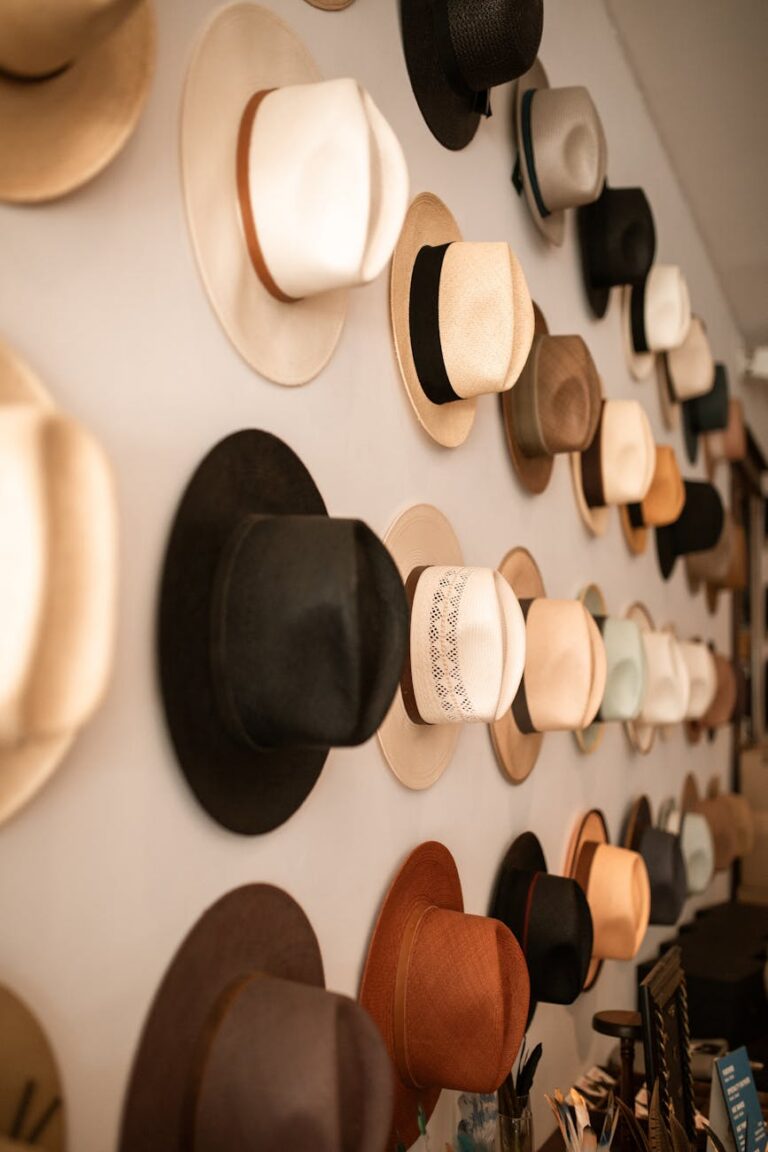 fedora hats hanging on the wall